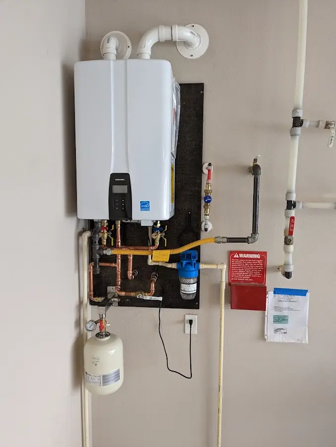 Professional plumber installing copper piping in a Mesquite home